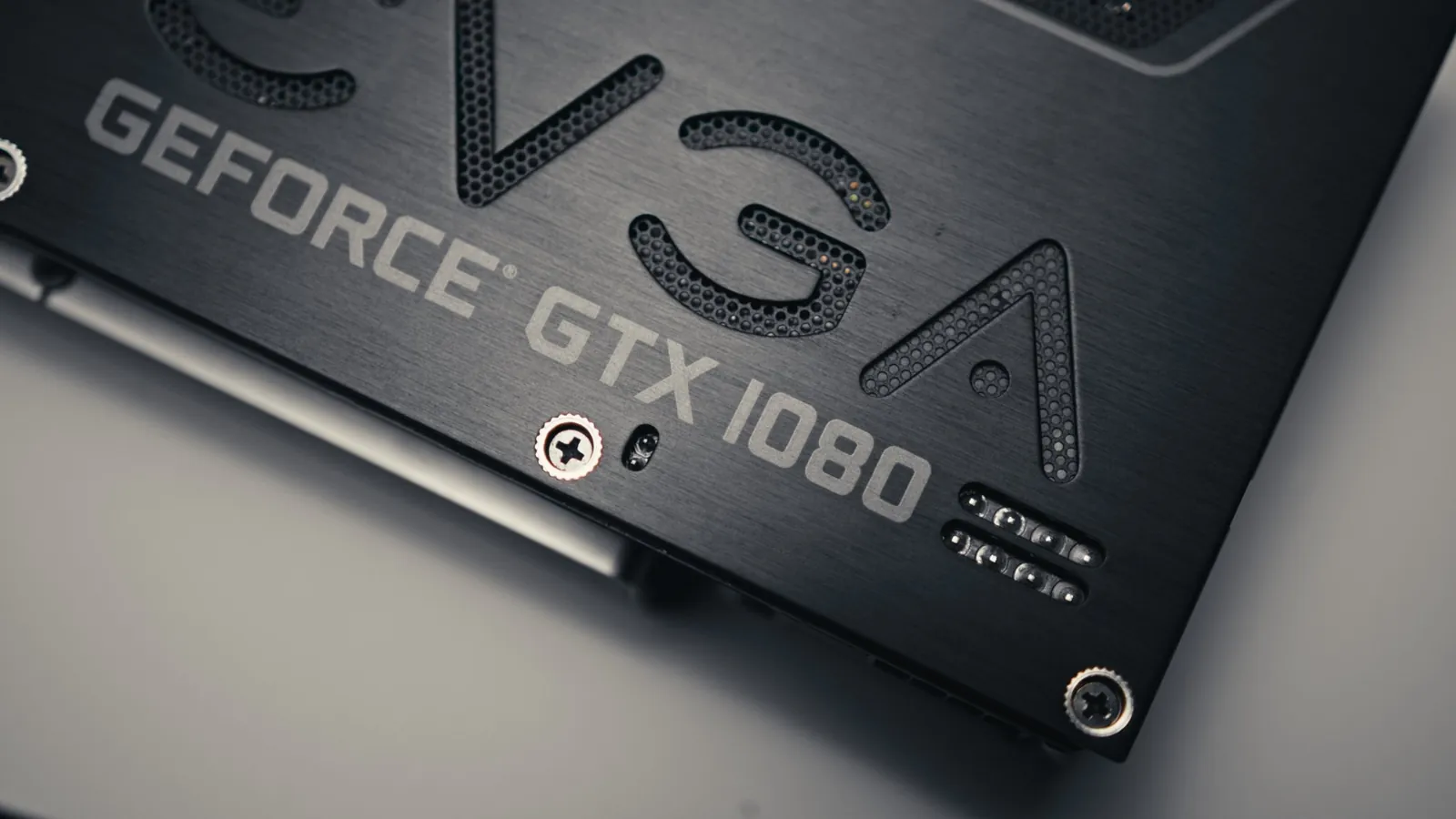 GPU backplate, macro detail. 2x macro · Tech hardware.